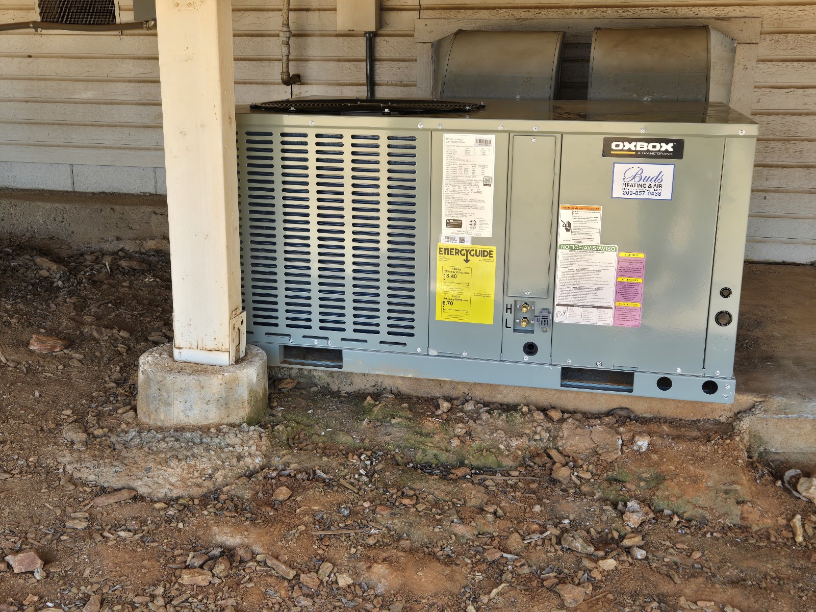 Oxbox package unit installed on concrete pad with Buds service sticker