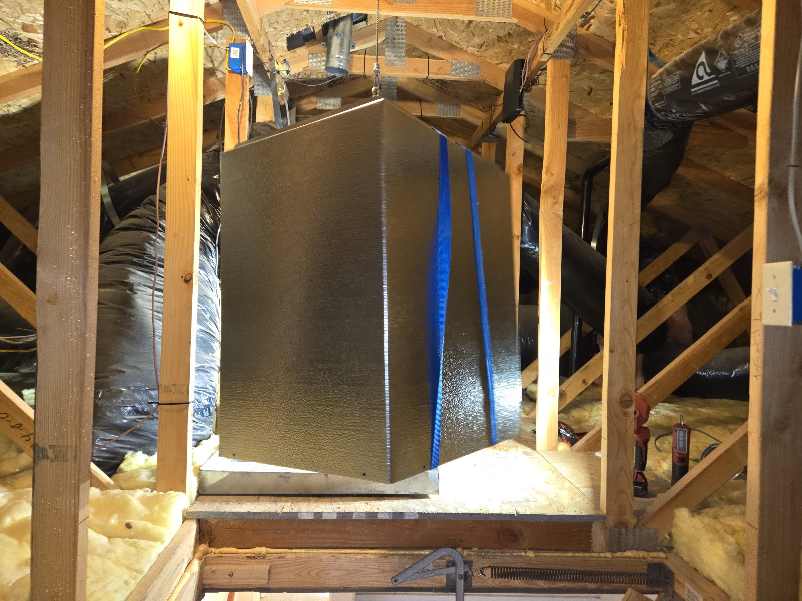 Insulated ductwork plenum installed in attic framing